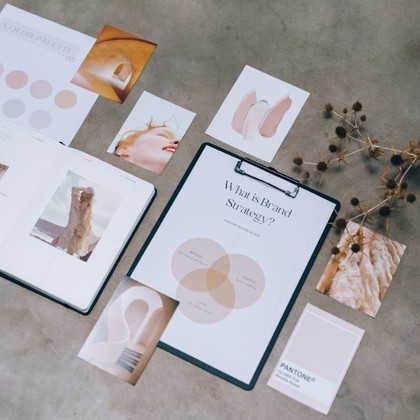 Brand strategy moodboard and color palette flat-lay